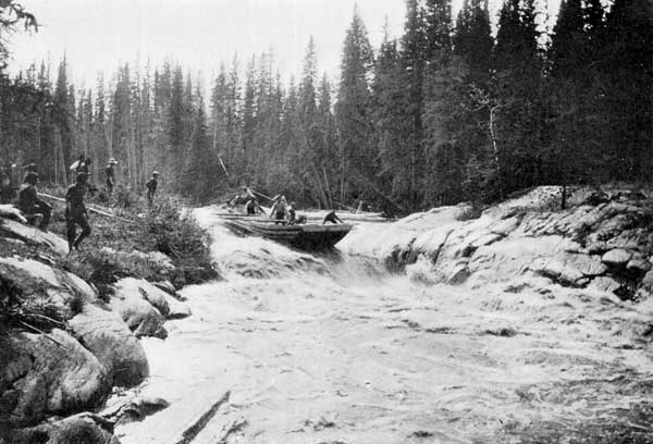 Traders running a mackinaw or keel-boat down the rapids
of Slave River without unloading.