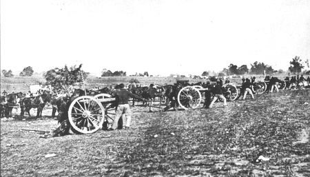 Artillerymen soften an objective for the infantry. Although field artillery was used extensively, it fcenterened and demoralized more
men than it wounded. Only 20 per cent of the battle casualties can be attributed to the artillery.